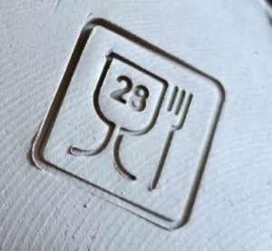 tampon alimentaire avec le chiffre 28 indiquant le plus haut niveau de sécurité au niveau contact avec des aliments